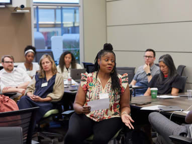 woman speaking to a group of people